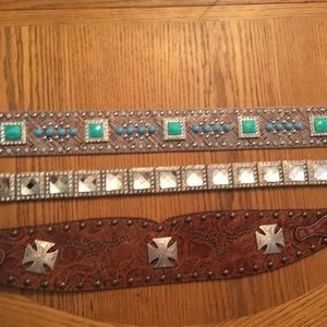 Three western thick Concho belts